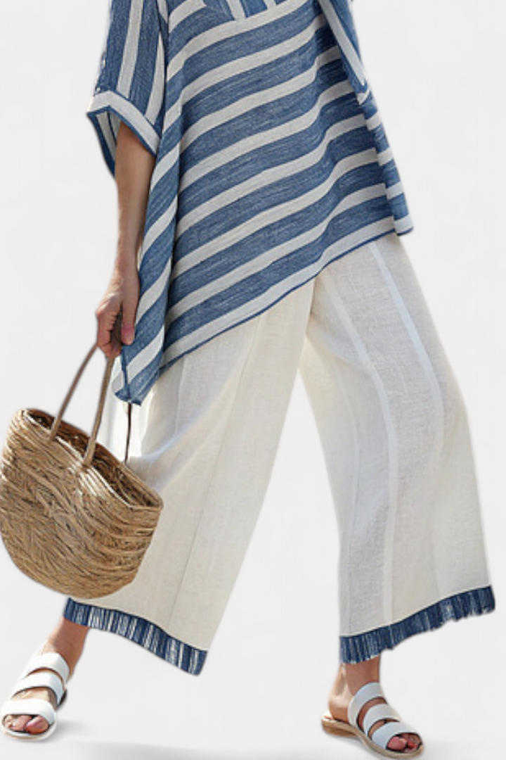 Veronica – sophisticated blue striped top and pants with details at the hem